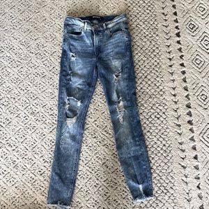 High waist, express distressed jeans with fringe ankle detail